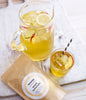 teapigs peach lemonade tea. Fersken limonade te i pakke, glas og kande.
